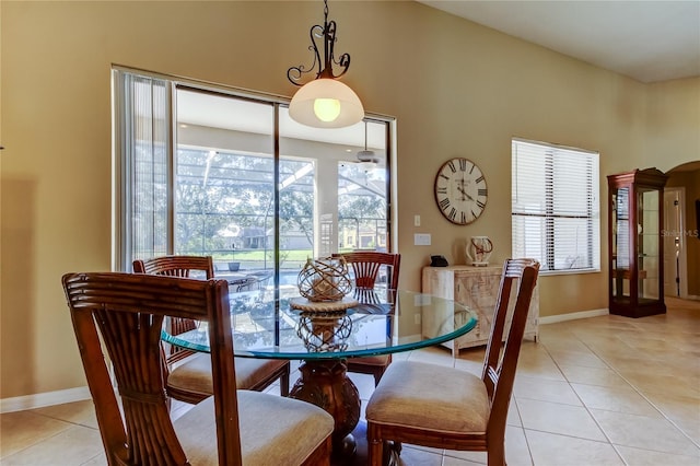 dining room featuring light tile patterned floors and baseboards