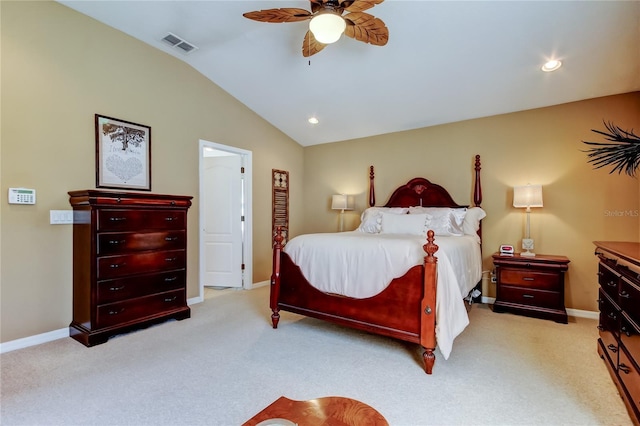 bedroom with light carpet, visible vents, baseboards, and vaulted ceiling