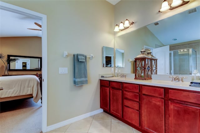 full bath featuring visible vents, vaulted ceiling, a stall shower, tile patterned floors, and a sink