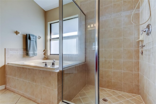 full bath with tile patterned flooring, a shower stall, and a garden tub