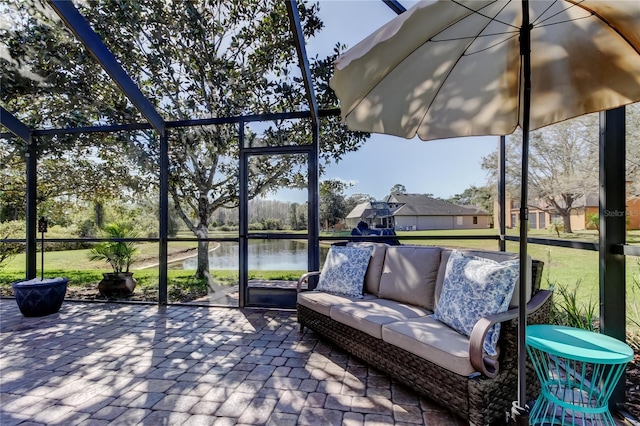 unfurnished sunroom featuring a water view