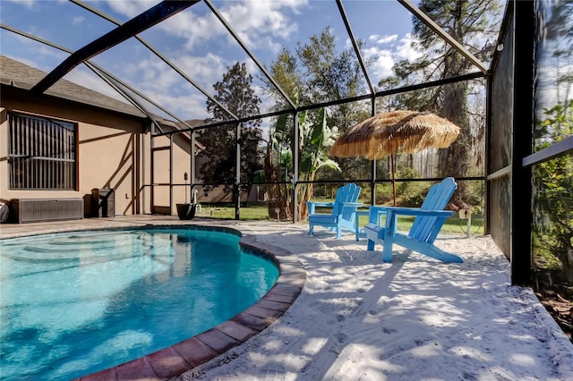 outdoor pool featuring a lanai and a patio