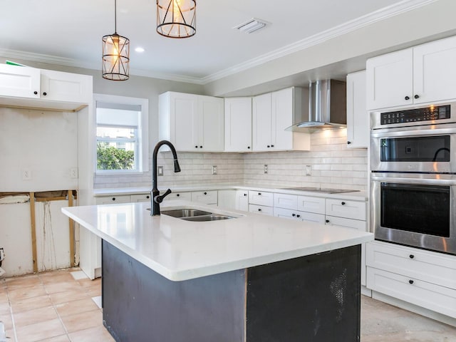 kitchen featuring double oven, crown molding, wall chimney range hood, decorative backsplash, and black electric stovetop