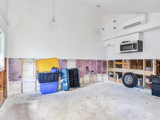 garage with a wall mounted air conditioner