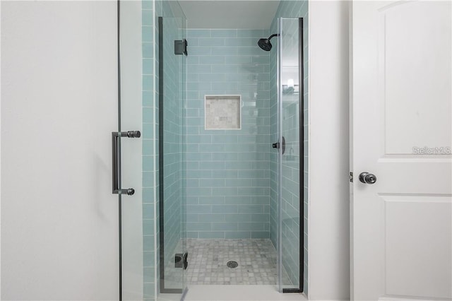 full bathroom featuring a stall shower