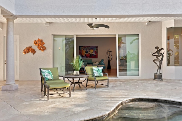 view of patio featuring a ceiling fan