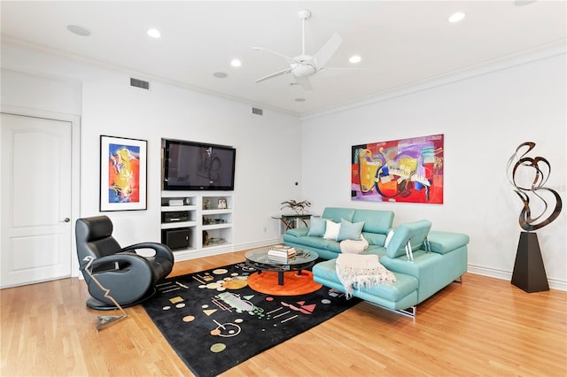 living room with visible vents, ornamental molding, wood finished floors, recessed lighting, and ceiling fan