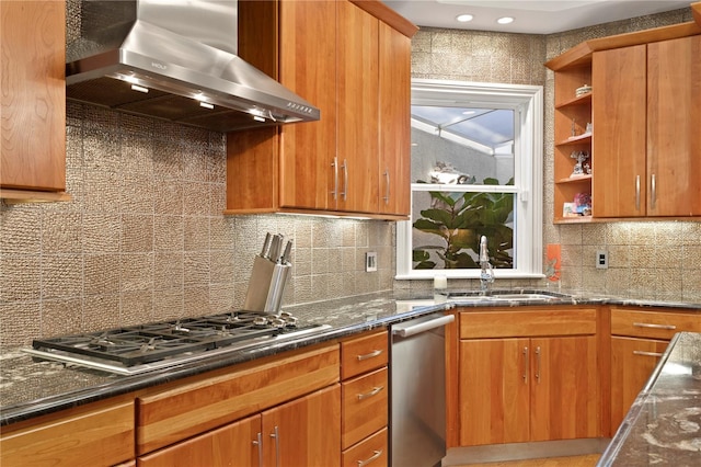 kitchen featuring brown cabinetry, open shelves, appliances with stainless steel finishes, wall chimney range hood, and backsplash