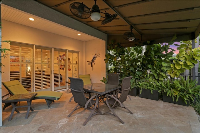 view of patio / terrace with outdoor dining space and a ceiling fan