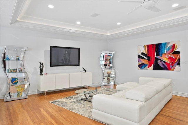 living room with a ceiling fan, recessed lighting, and wood finished floors