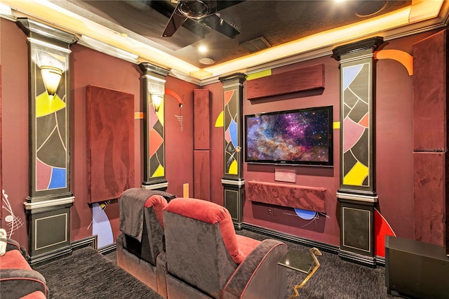 cinema featuring decorative columns, a ceiling fan, carpet flooring, and crown molding