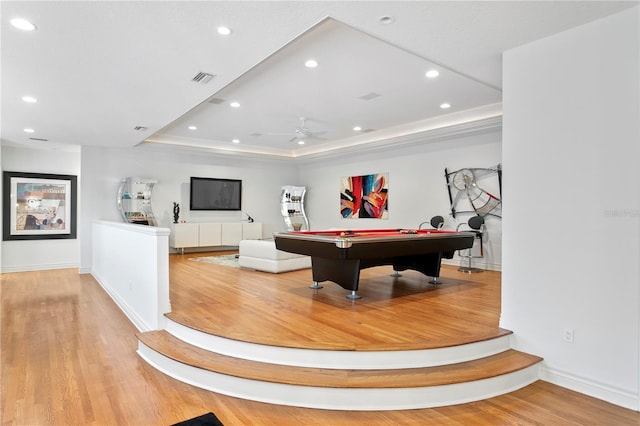 game room with billiards, a ceiling fan, wood finished floors, recessed lighting, and a raised ceiling