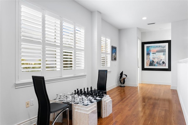 dining space with visible vents, recessed lighting, wood finished floors, and baseboards