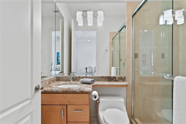 full bathroom with visible vents, vanity, a shower stall, and toilet