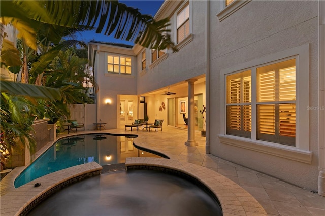 view of pool featuring a patio area and a pool with connected hot tub