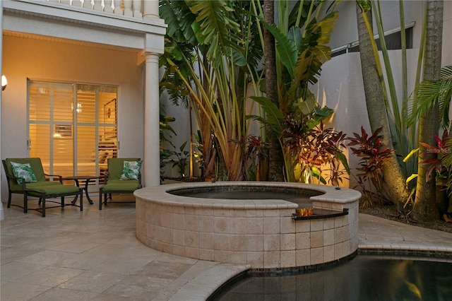 view of patio featuring an outdoor hot tub