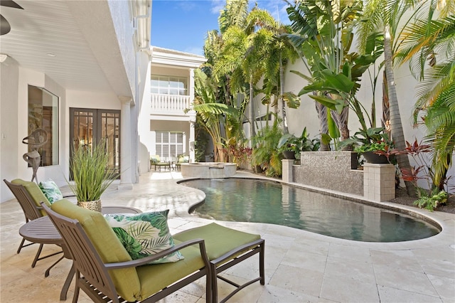 outdoor pool featuring a patio