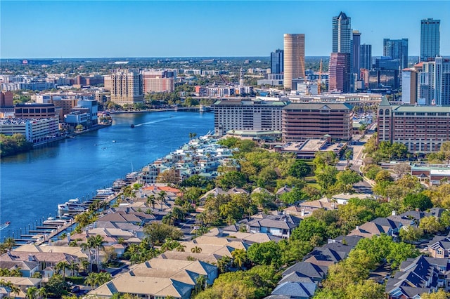 birds eye view of property with a city view and a water view