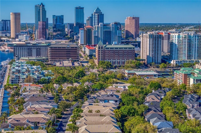 birds eye view of property featuring a city view and a water view