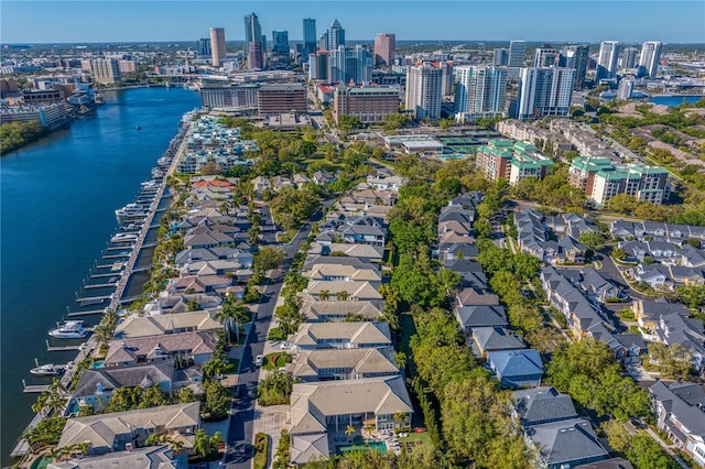 birds eye view of property featuring a city view and a water view