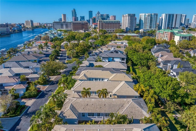 birds eye view of property featuring a view of city and a water view