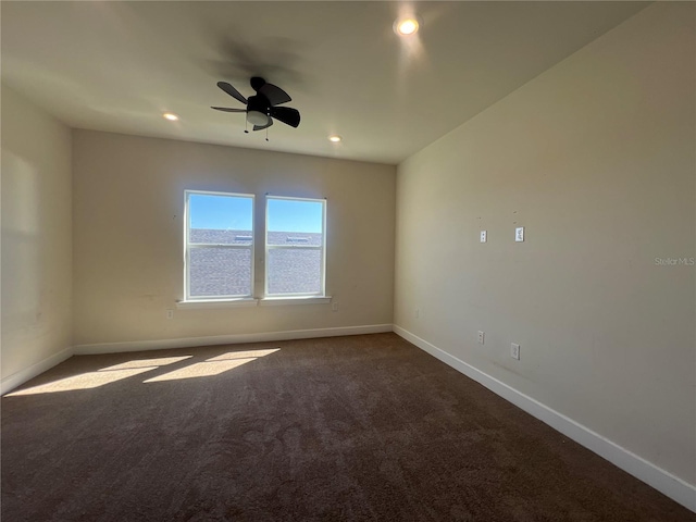 empty room featuring dark colored carpet, baseboards, a ceiling fan, and recessed lighting