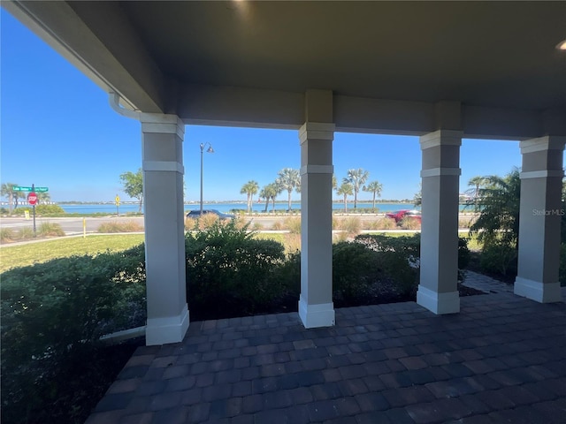 view of patio with a water view