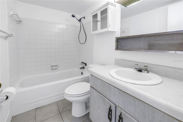 full bathroom featuring tile patterned floors, toilet, tub / shower combination, and vanity