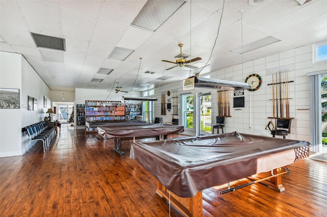8220 112th St N Unit 206, Seminole, FL 33772 - recreation room featuring billiards table, wood finished floors, a ceiling fan, healthy amount of natural light, and a paneled ceiling
