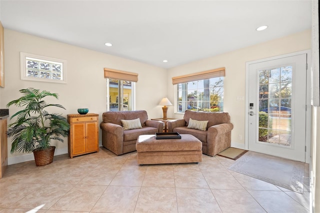 living area featuring light tile patterned floors, recessed lighting, and baseboards