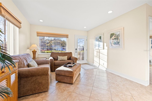 living area with light tile patterned floors, recessed lighting, and baseboards