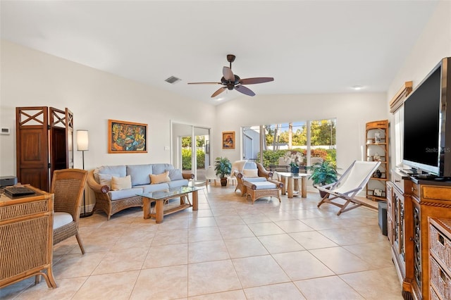 living area with light tile patterned floors, visible vents, lofted ceiling, and a ceiling fan