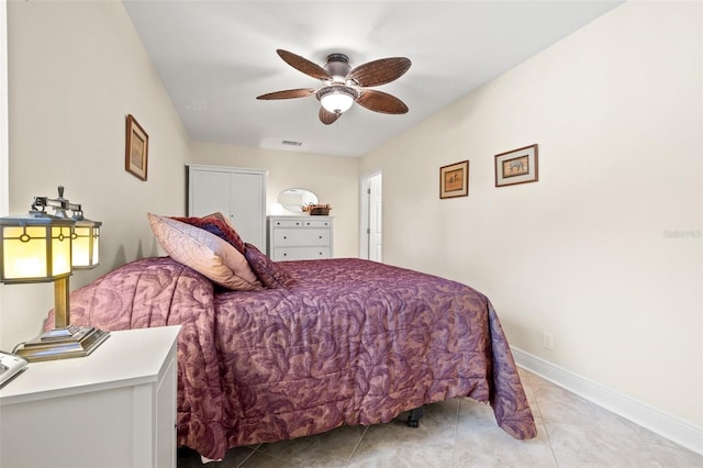 bedroom with light tile patterned floors, baseboards, visible vents, and ceiling fan