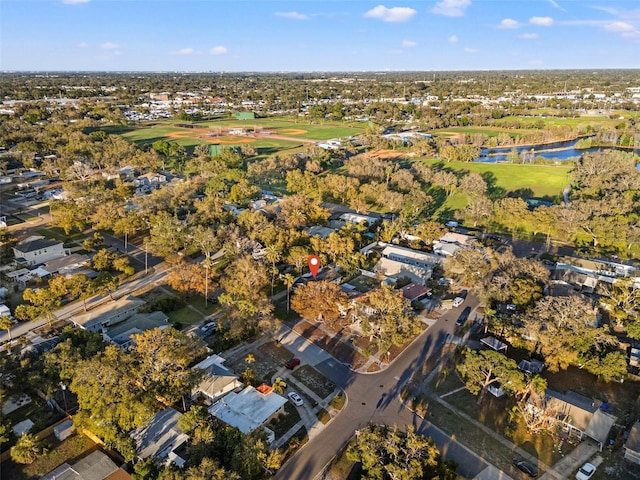 bird's eye view featuring golf course view and a water view