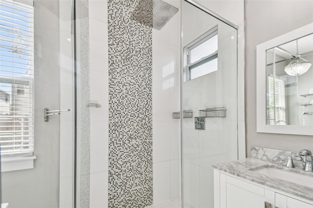 bathroom with vanity and a shower stall