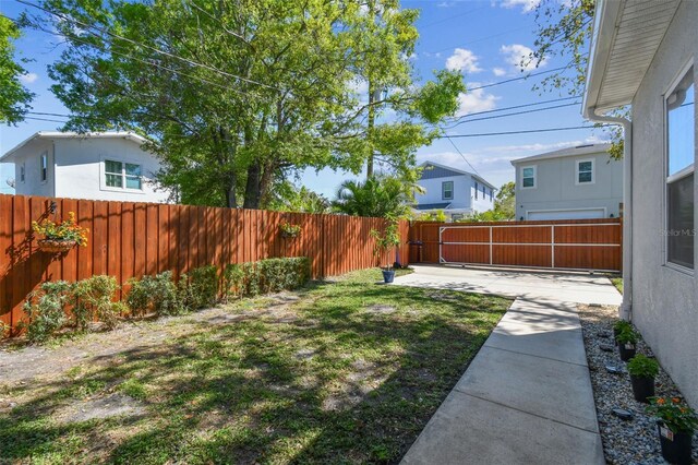 view of yard with a patio area and a fenced backyard