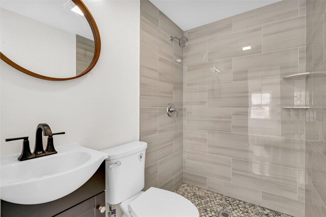 304 E Hanlon St, Tampa, FL 33604 - full bath featuring toilet, a tile shower, and vanity