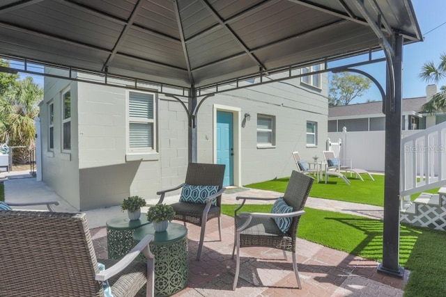 view of patio / terrace with a gazebo and fence