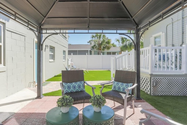 view of patio / terrace featuring a gazebo and fence