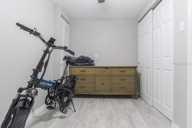 workout area with light wood-type flooring