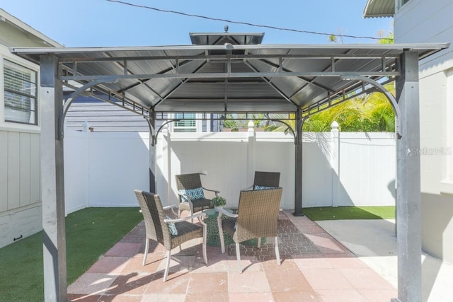 view of patio / terrace featuring a gazebo and fence