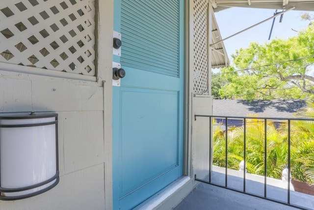 entrance to property with a balcony