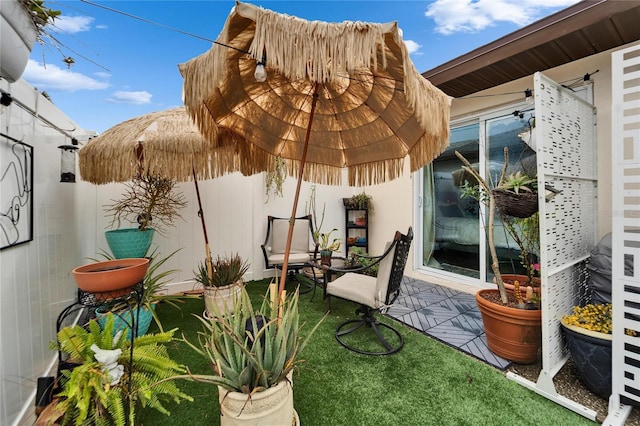 view of patio featuring fence