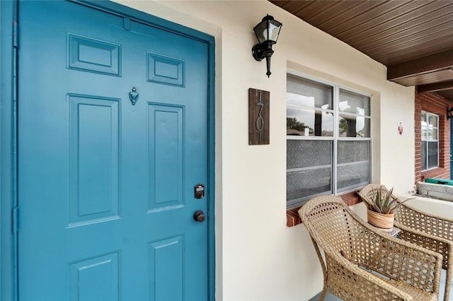 property entrance featuring covered porch