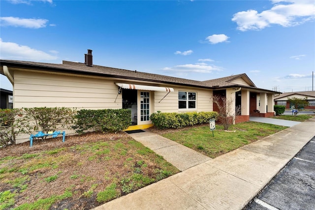 ranch-style house with a front yard