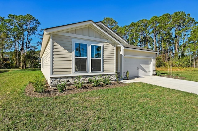 view of front of property featuring an attached garage, concrete driveway, a front lawn, stone siding, and board and batten siding