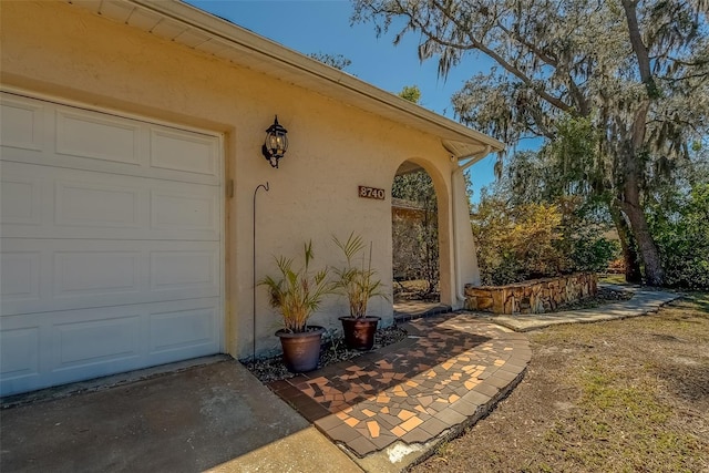 entrance to property with stucco siding