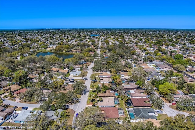 drone / aerial view with a residential view and a water view