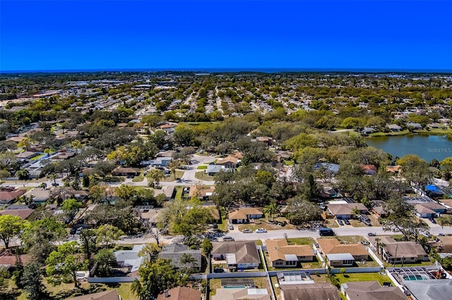 bird's eye view featuring a residential view and a water view