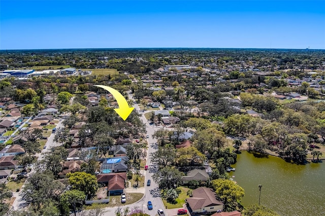 drone / aerial view featuring a residential view and a water view